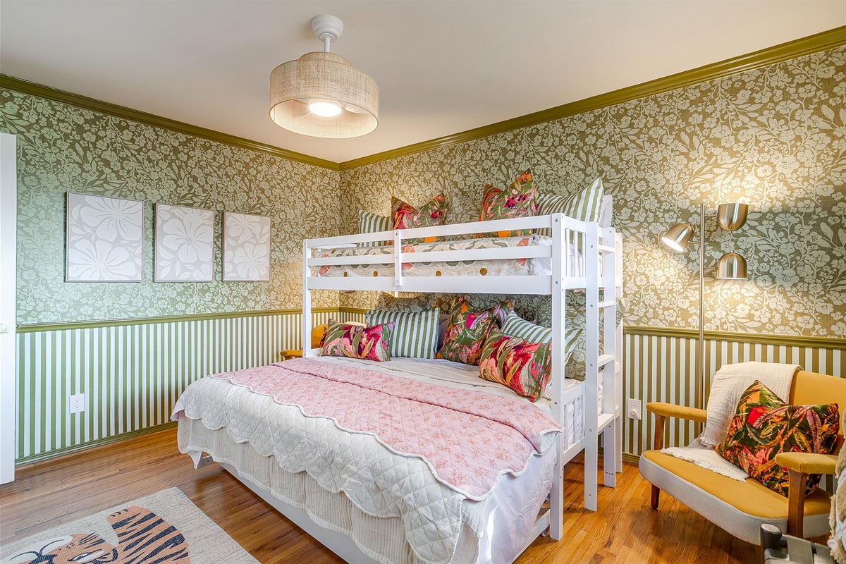 Additional guest bedroom with bold wallpaper accents