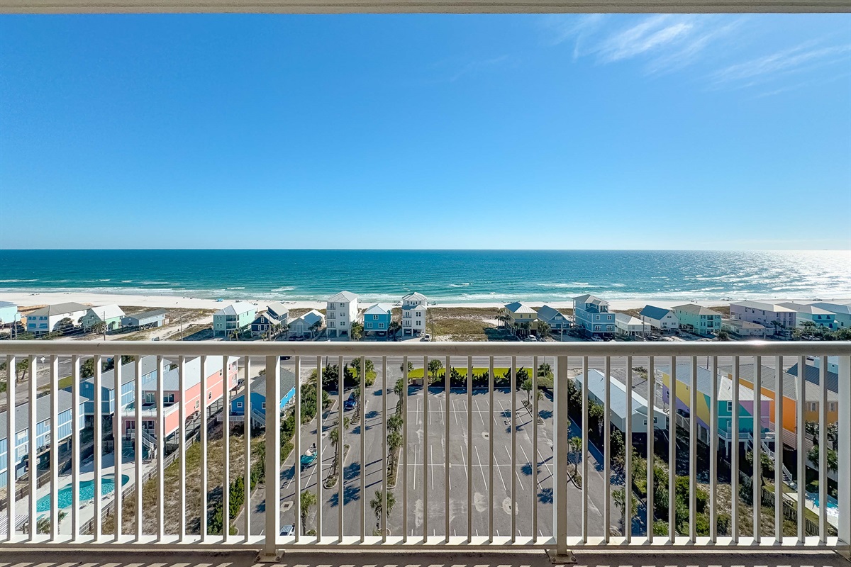 Witness endless blue horizons and the vibrant beach scene from your expansive balcony, perfectly positioned with the beach just steps away across the street.