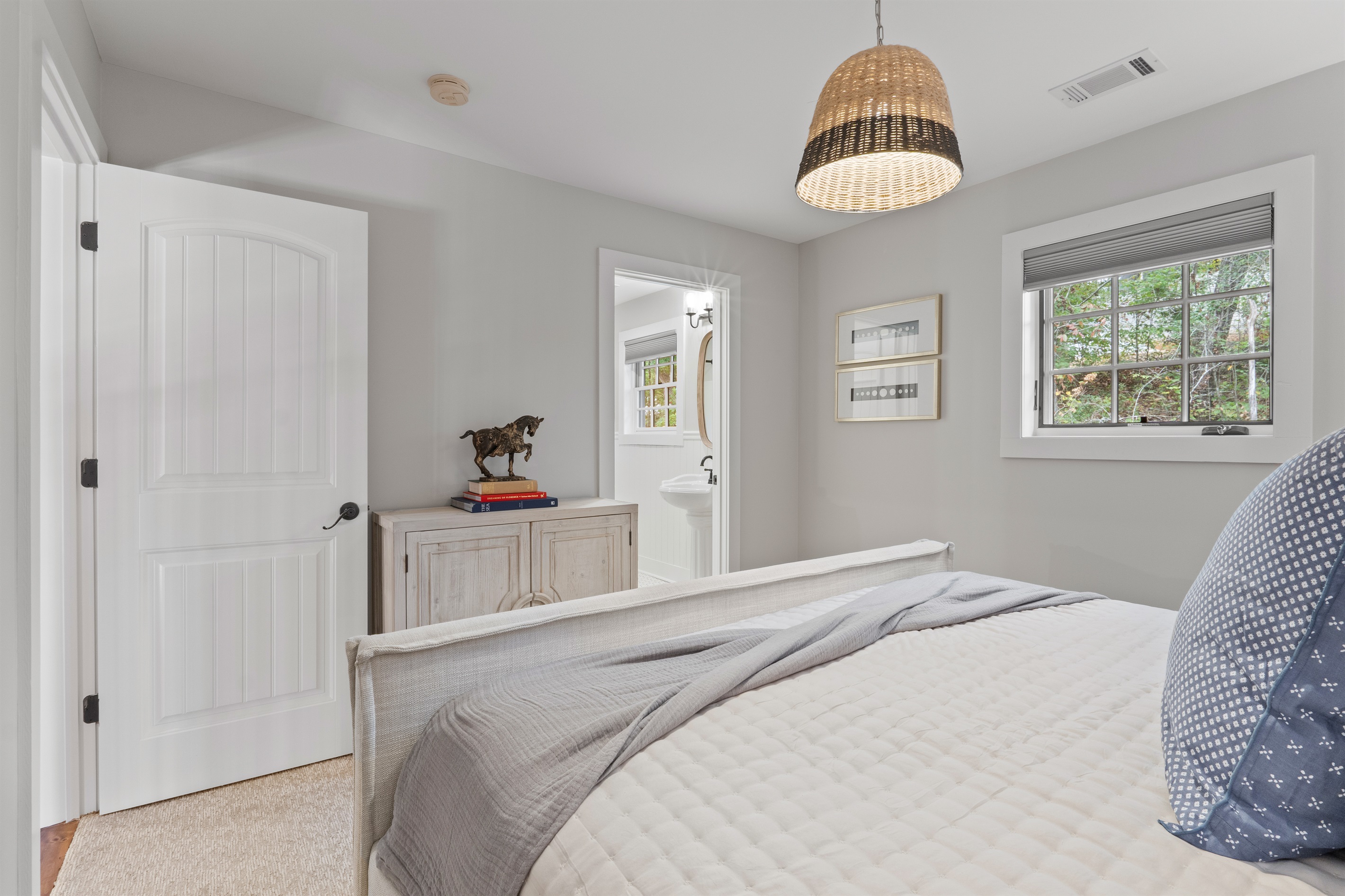 The third bedroom offers a king bed, updated bedding and décor, and direct access to the second bathroom for added comfort and convenience.