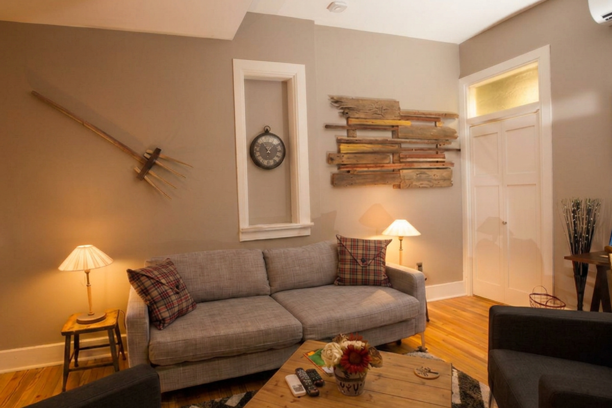 Skorda’s historic floor plan kept original windows over sofa and converts to bed