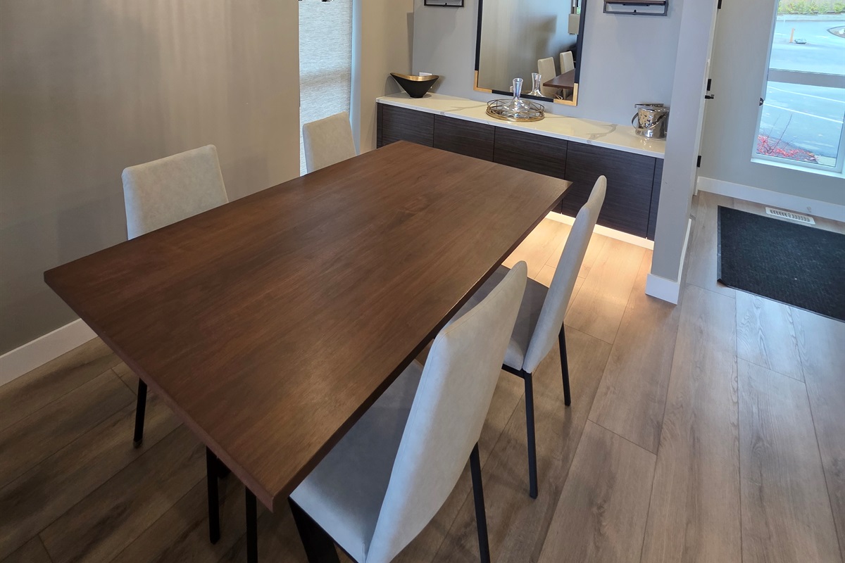 Dining area. Fully stocked with higher end glassware and coffee machine.