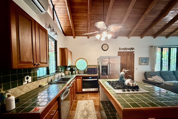 Fully stocked kitchen with dishwasher, disposal, oven, and gas rangetop