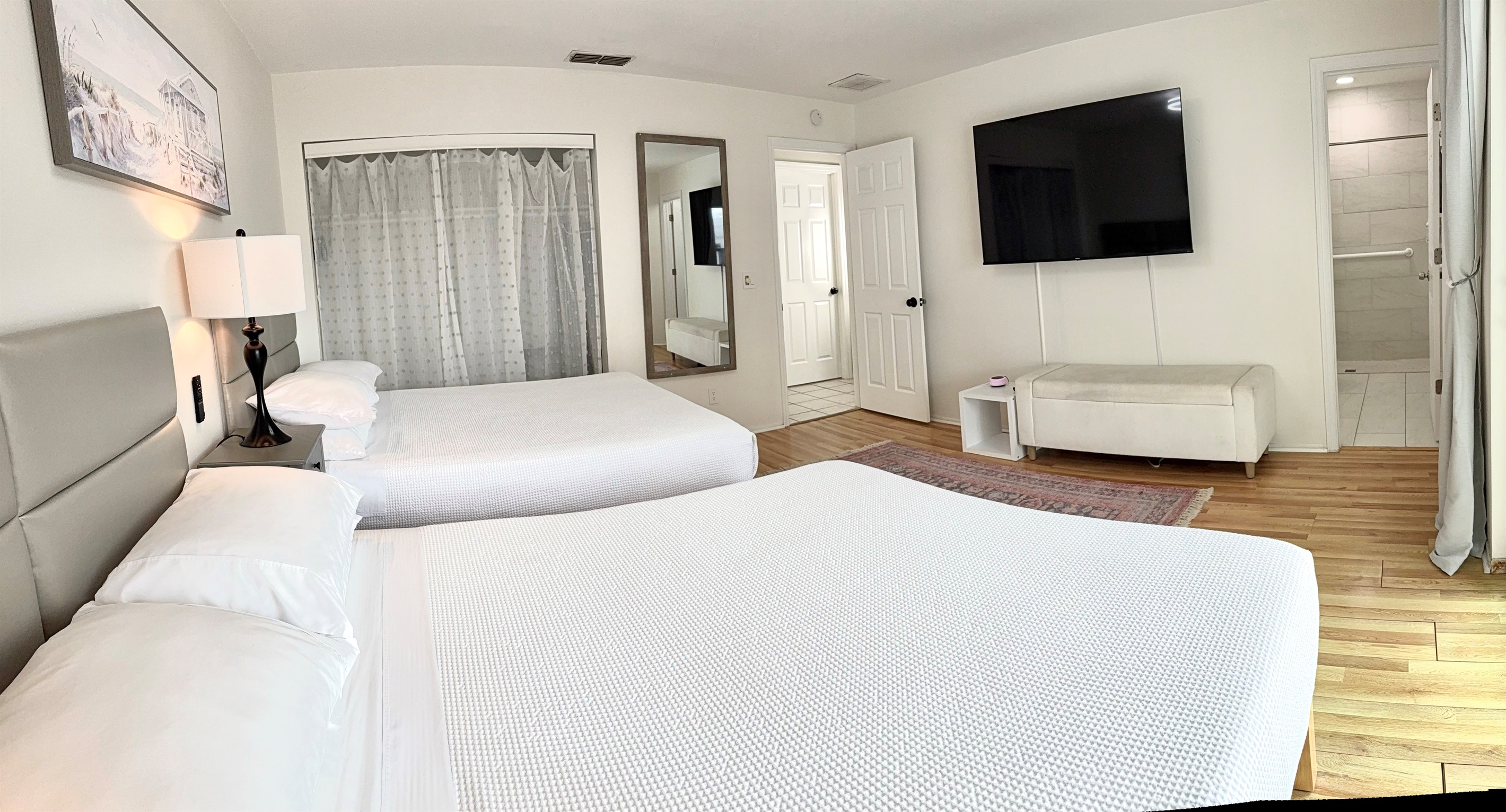 Master bedroom - 2 Queen size beds with memory foam mattresses and smart 65" TV.  En-suite (attached) bathroom.