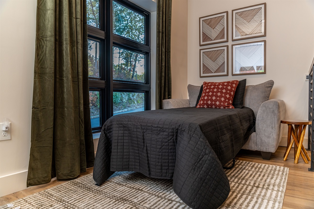 Twin sleeper chair in the loft for flexible sleeping space