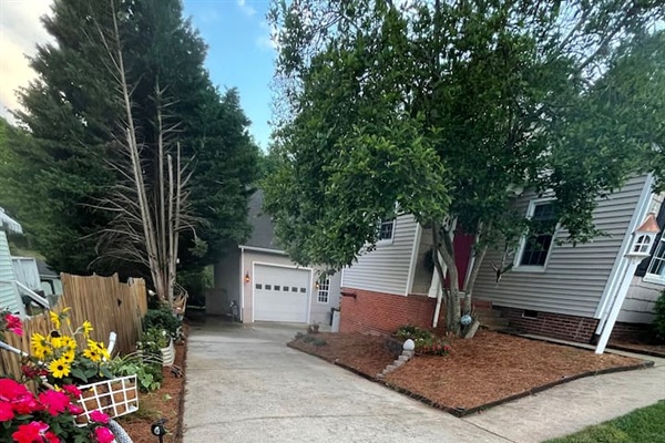 Just walk down our driveway and the entrance is to your right under the new deck. 