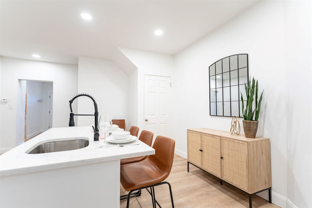 Chic kitchen dining countertop featuring a beautiful set of dishes, perfect for enjoying meals in style.