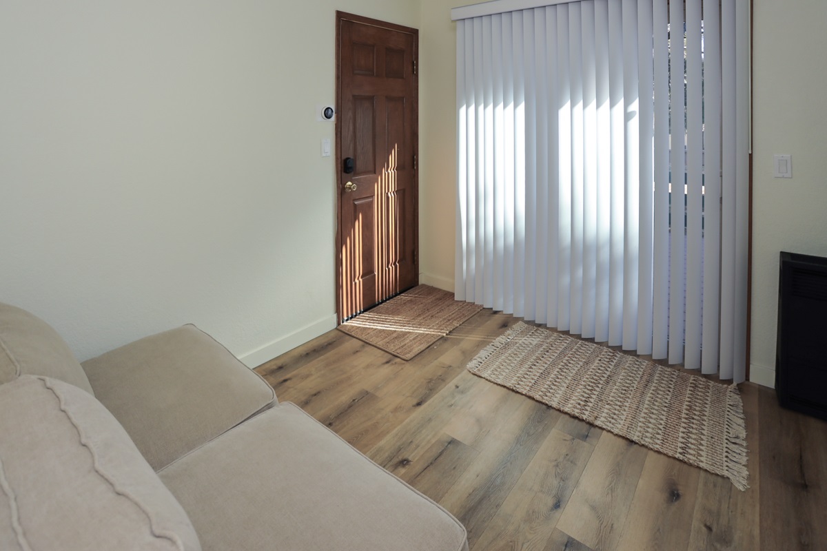 Laundry lounge opens up by sliding glass door to the deck