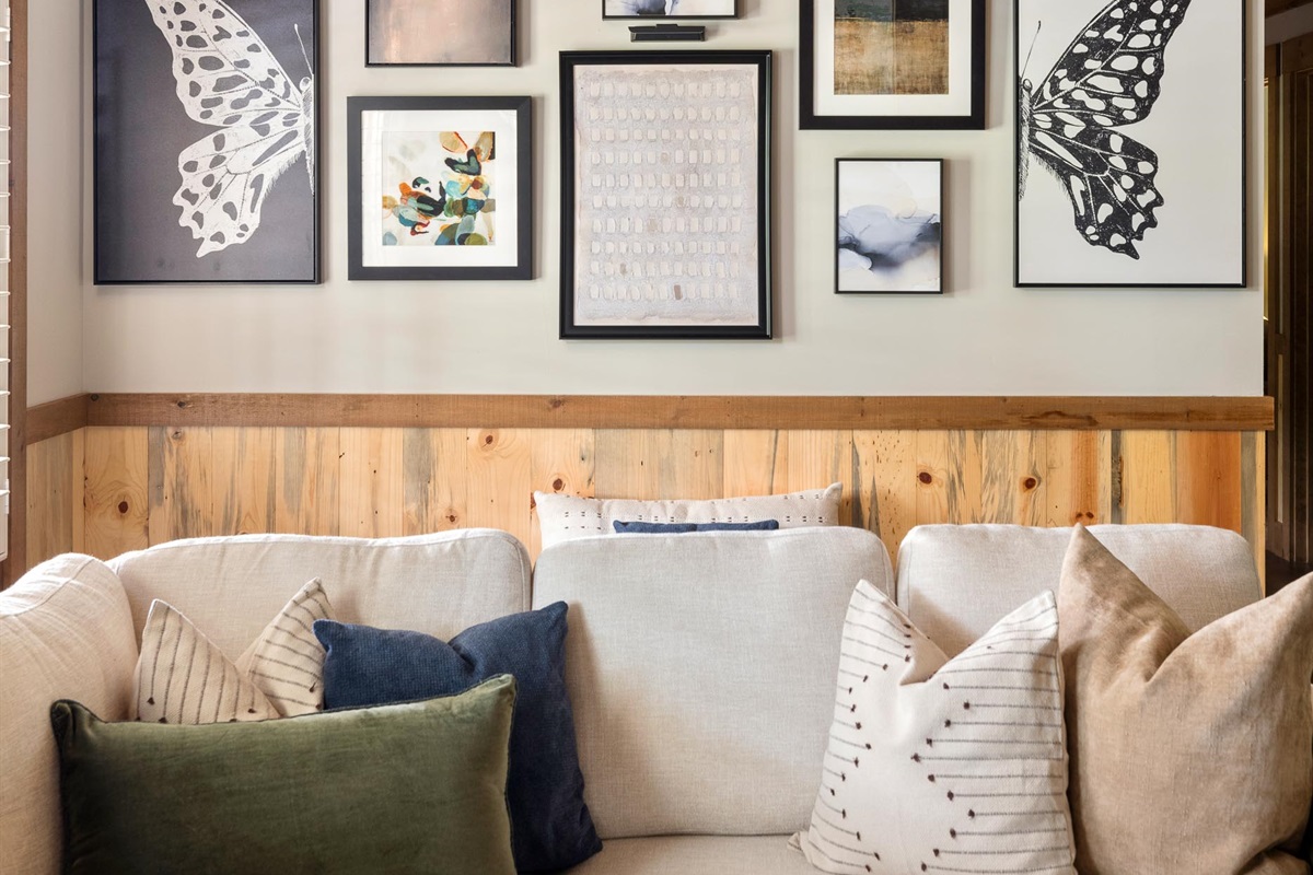 Plush pillows, thoughtful textures, and art that grounds the space, this is modern cabin living, elevated.