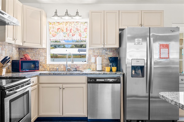 Kitchen with cookware, dishes and utensils for 10!   Kitchen includes coffee, paper towels and starter set of Dishwasher detergent.