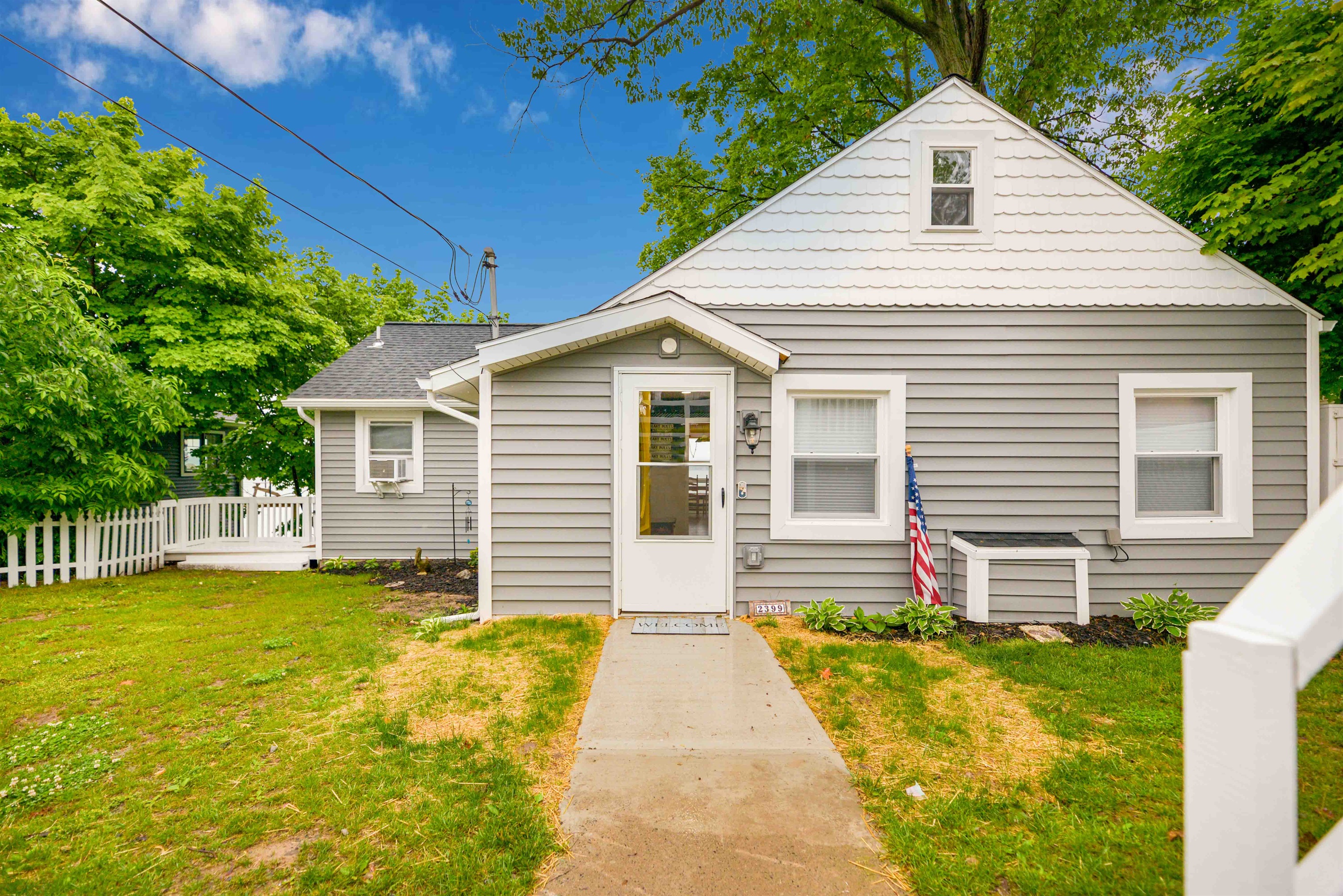Charming front entry with classic cottage curb appeal and a welcoming vibe.
