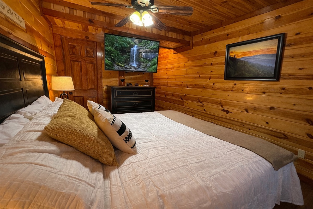 Settle in for the perfect movie night for two in this cozy mountain bedroom.
