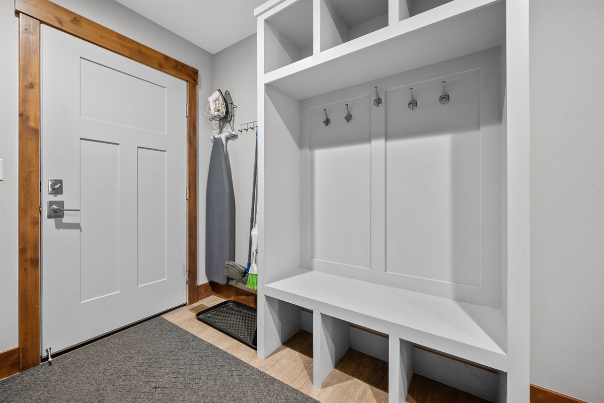 Mudroom entry with hooks and storage for gear
