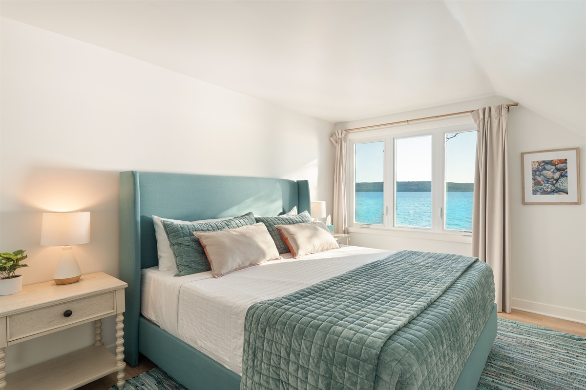 Enjoy the kaleidoscope of colors of Crystal Lake from the second floor bedroom, with a king bed and memory foam mattress. 