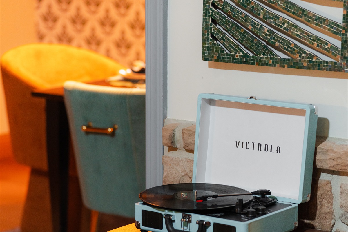 Relax with the timeless sounds of vinyl from the Victrola record player.