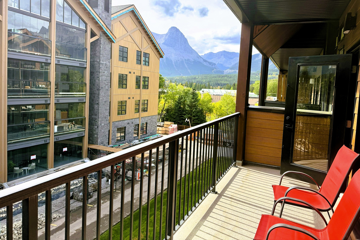 Spacious private balcony, with partial mountain view, Ha Ling Peak visible on your right.