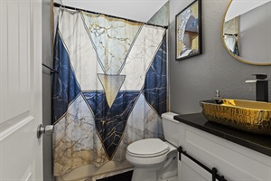 Escape to a bathroom retreat where tranquility blossoms, and the full suite of amenities ensures a rejuvenating experience.