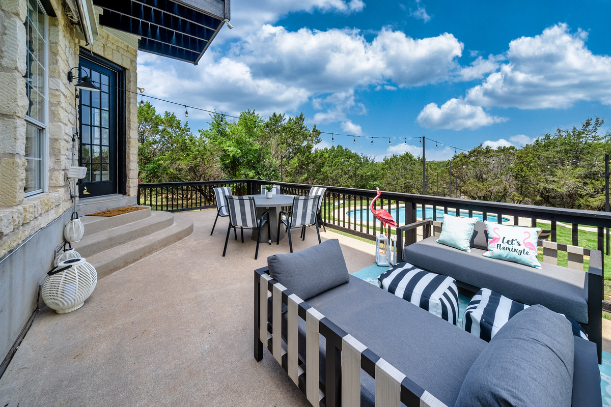 Elevated deck seating overlooks the pool — the perfect spot to unwind.