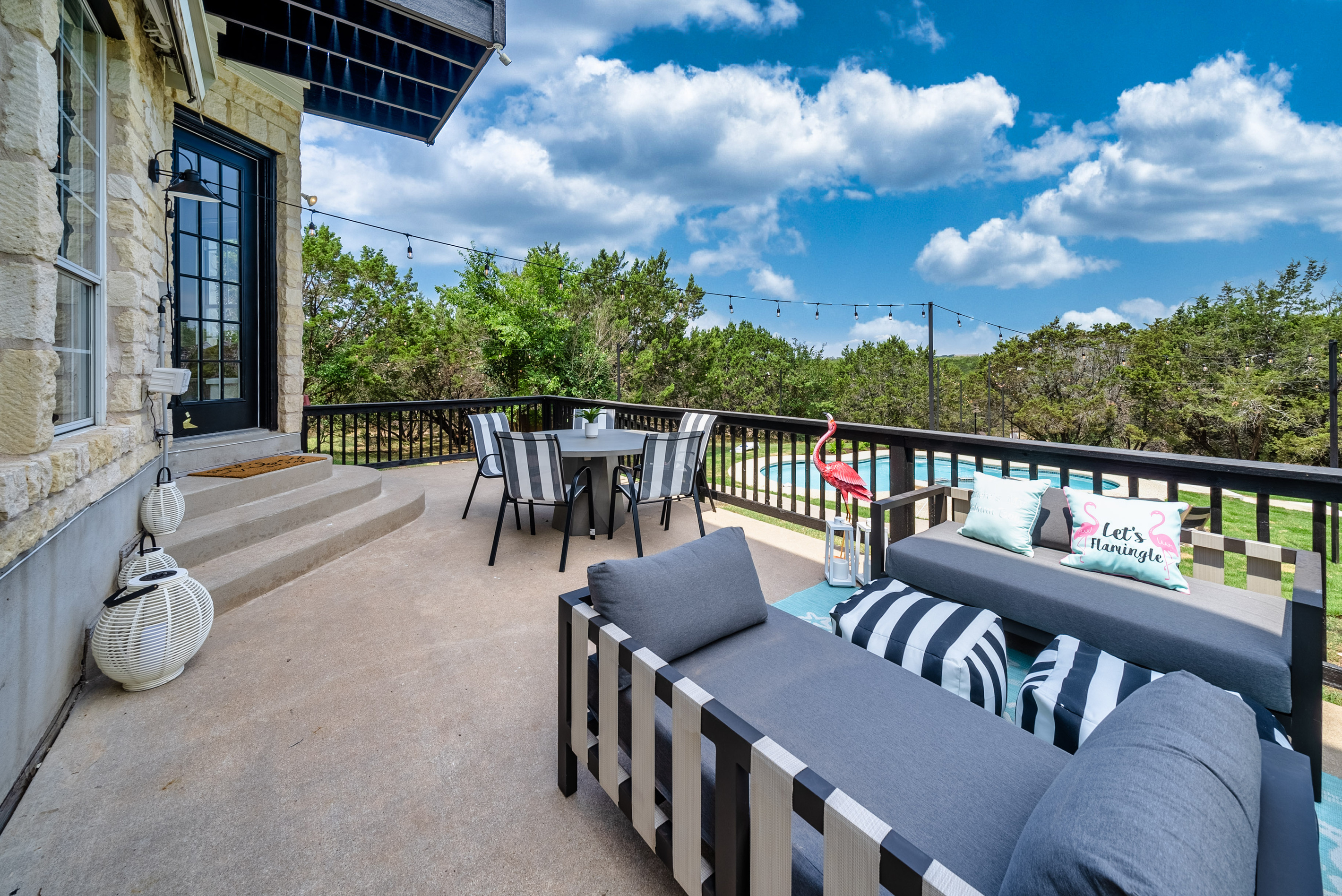 Elevated deck seating overlooks the pool — the perfect spot to unwind.