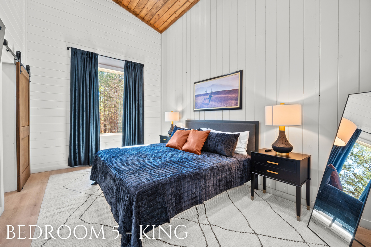 With its inviting color scheme and cozy setup, this king bedroom offers a peaceful space to rest and rejuvenate.