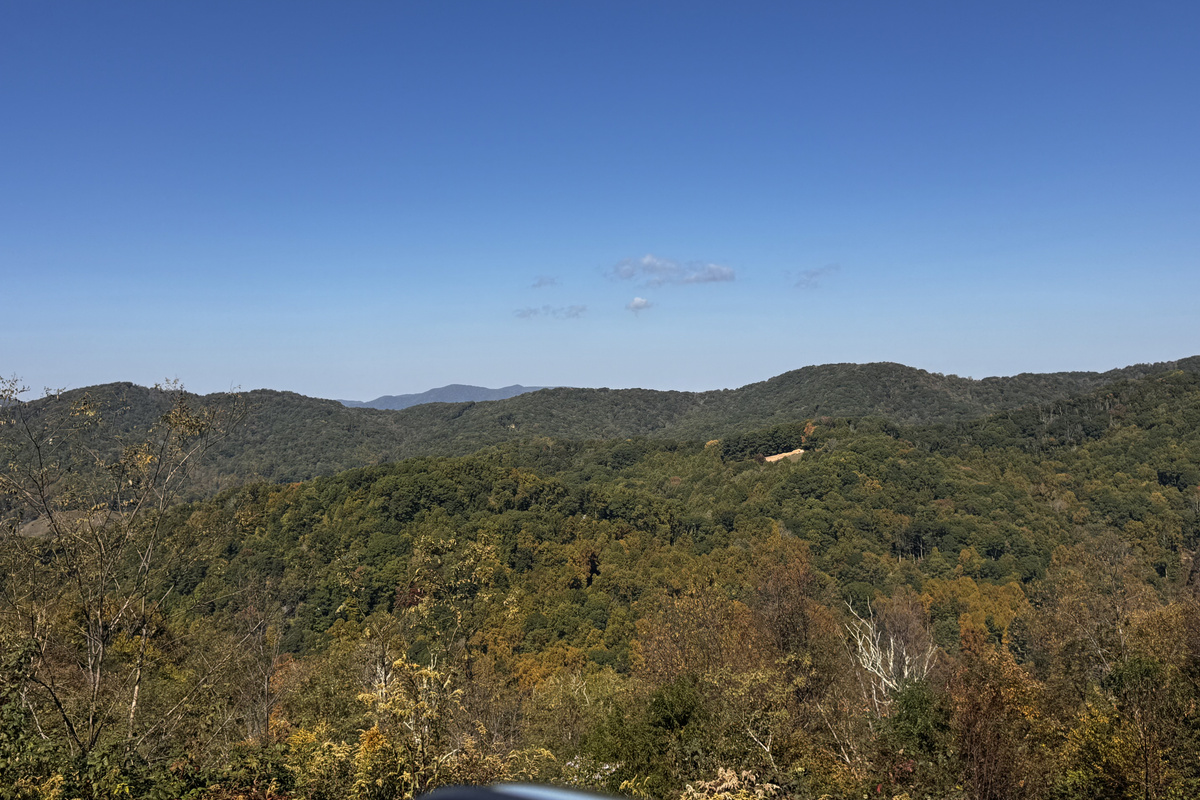 Long-range mountain views and wooded ridgelines surround your Scenic Wolf getaway.