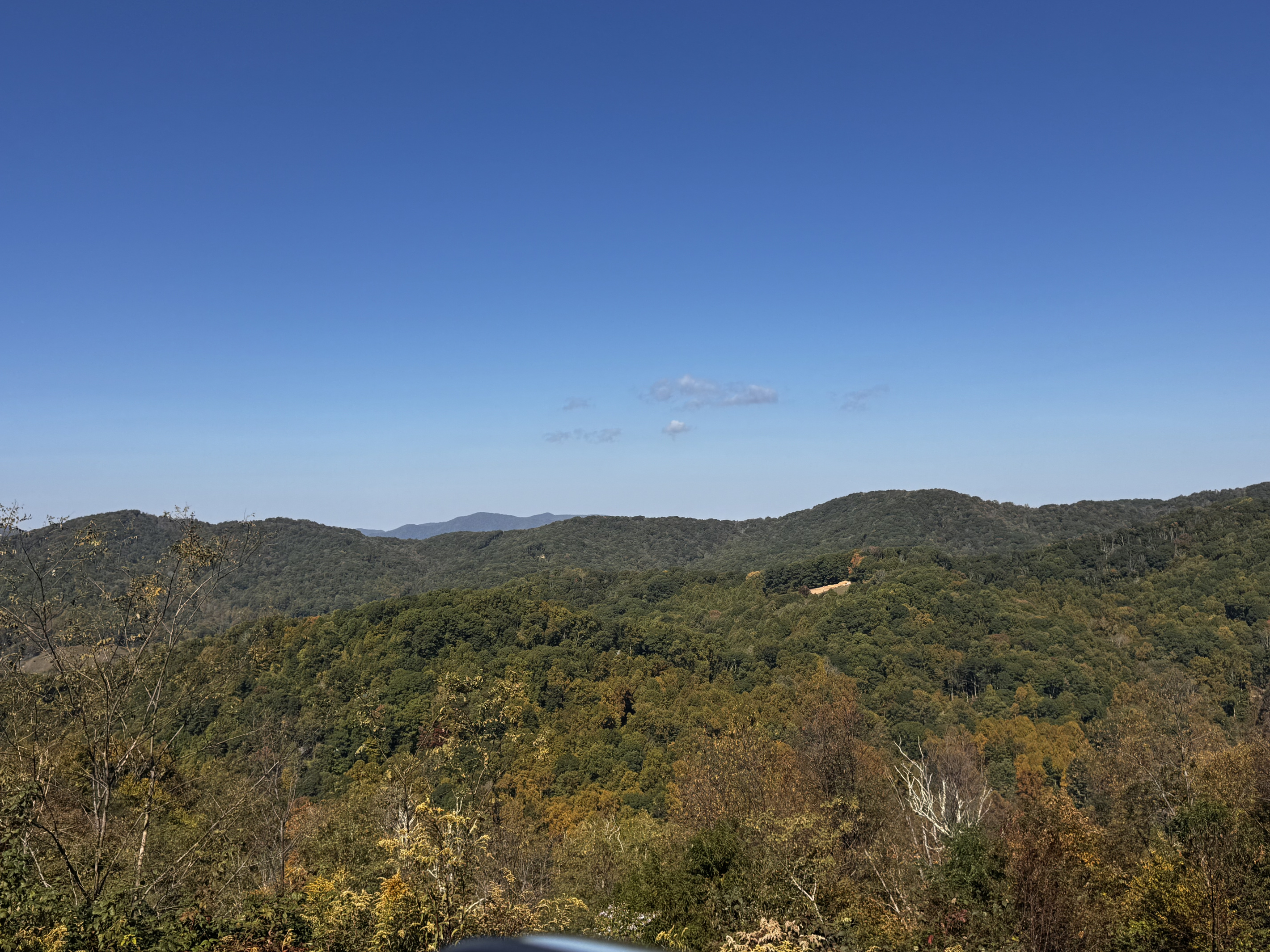 Long-range mountain views and wooded ridgelines surround your Scenic Wolf getaway.