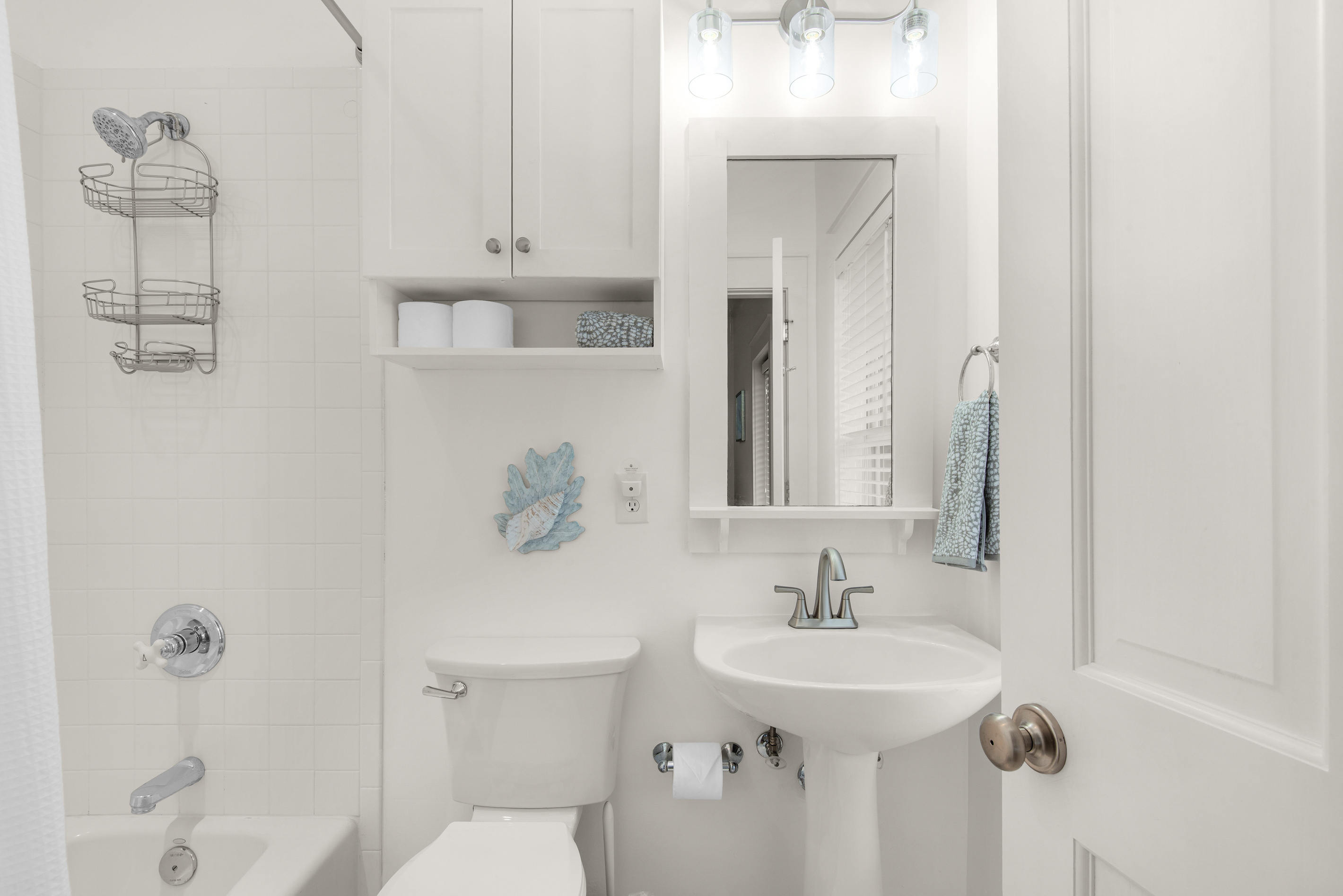 Seagrove Bungalow 103 full bathroom with a bathtub and shower combination.