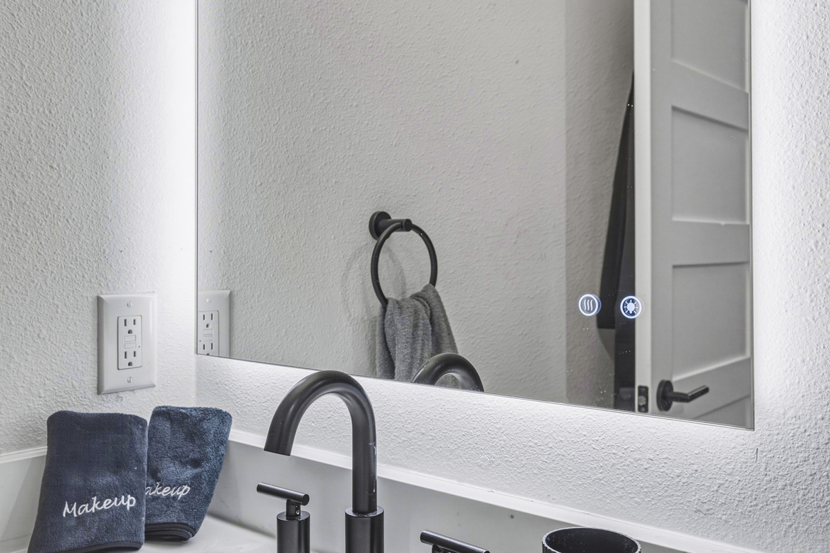 Enjoy modern fixtures and chic towels for a refreshing experience!