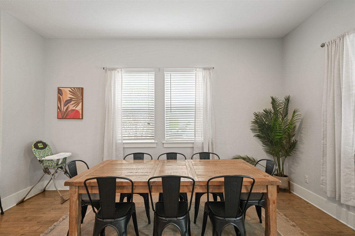Dining area with large table and seating—perfect for shared meals and gatherings. 