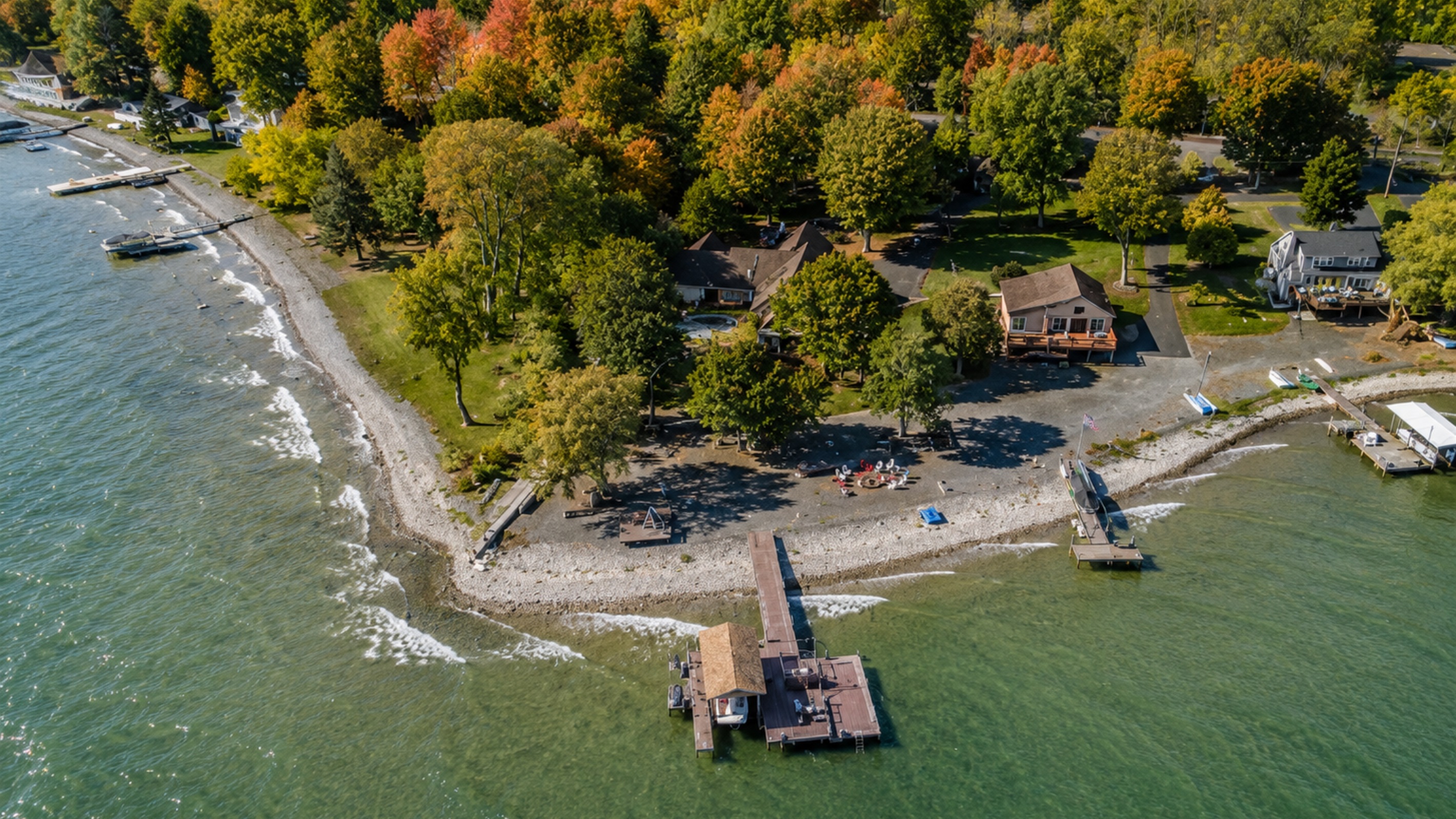Lakefront escape nestled in fall colors with a private shoreline perfect for morning coffee views. Ideal for guests seeking peaceful Finger Lakes relaxation.