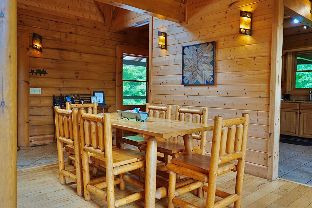 Dining Area: Gather around the rustic table, surrounded by natural wood and serene views!