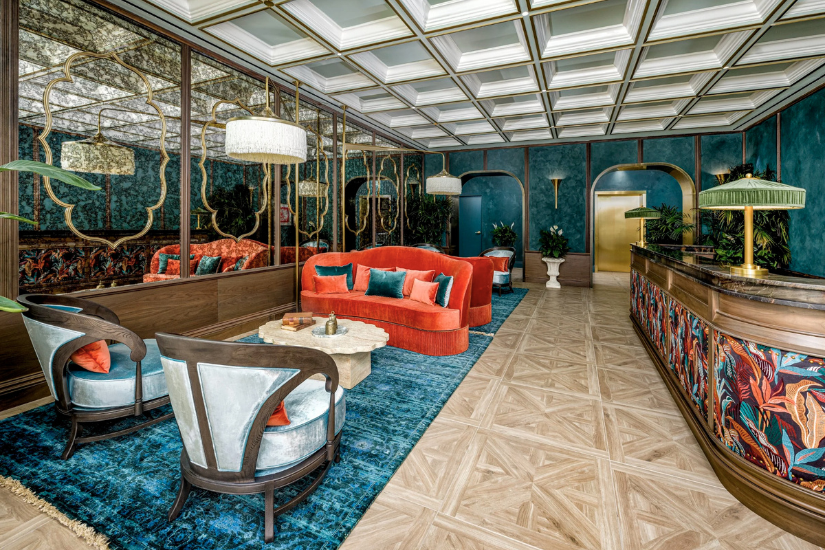 A vibrant club lounge with a statement bar, bold color and layered textures - made for evenings with friends.
