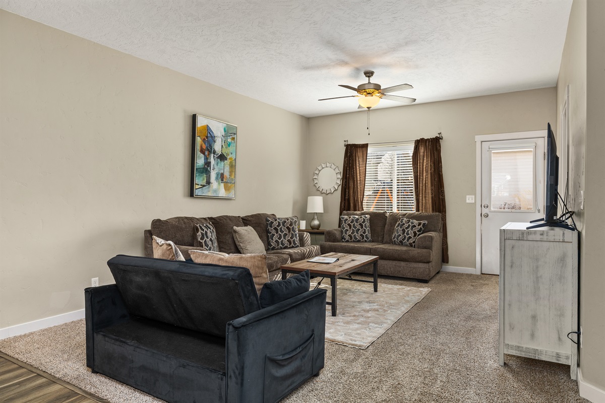 Relax in style in the living room complete with a sleeper sofa and flat screen TV!