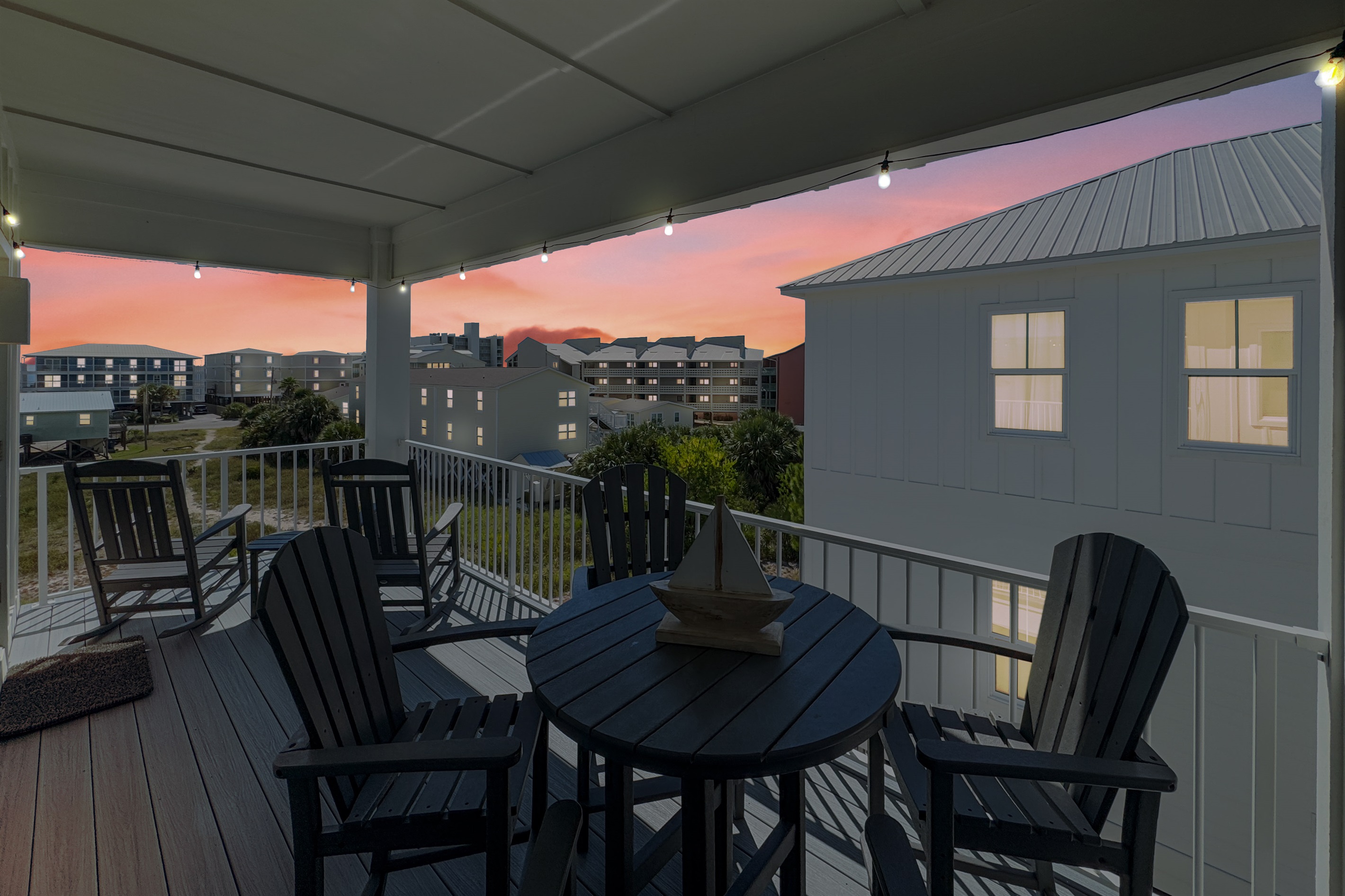 Gorgeous views with rocking chairs, a high top table, plus wonderful breeze