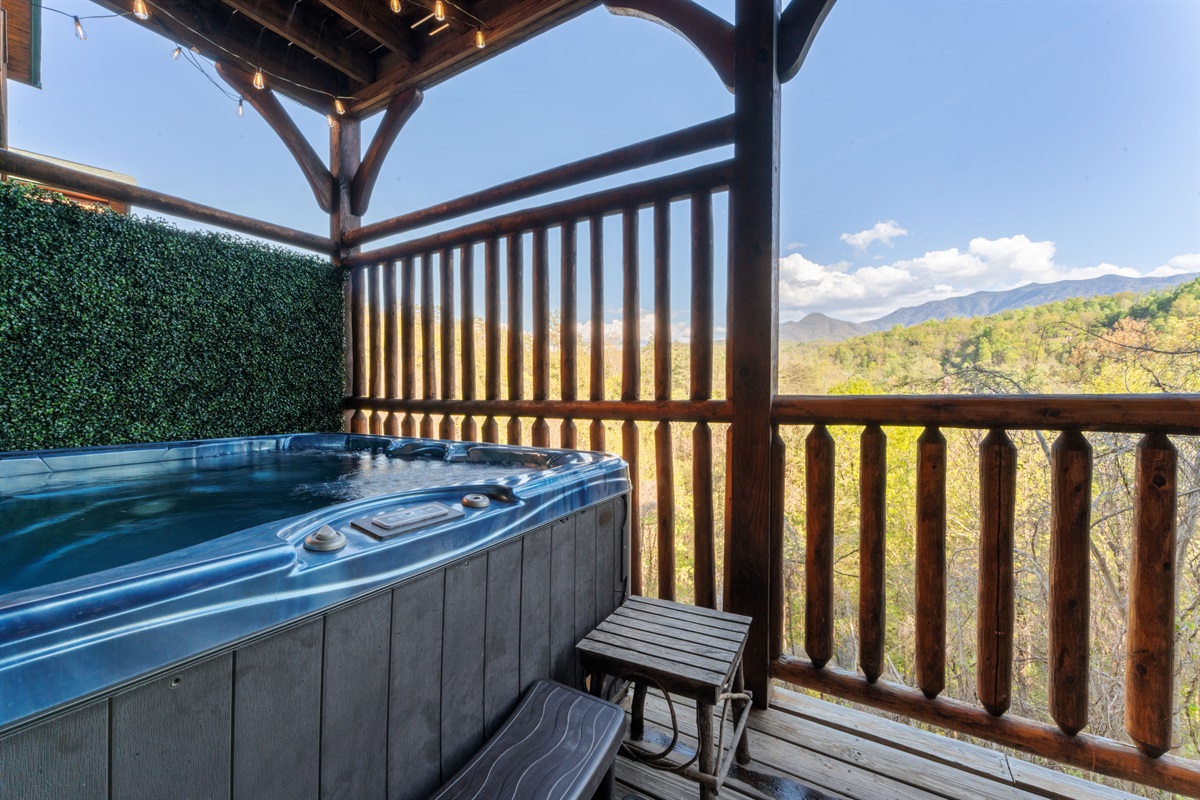 Enjoy the view of Mt LeConte from the hot tub on the lower deck.