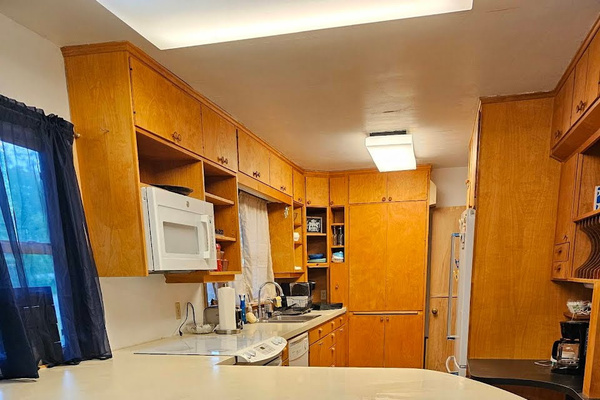 Full kitchen with stove, oven, microwave, refrigerator, and dishwasher. Plates, cups, silverware, pots, pans, and most essentials.