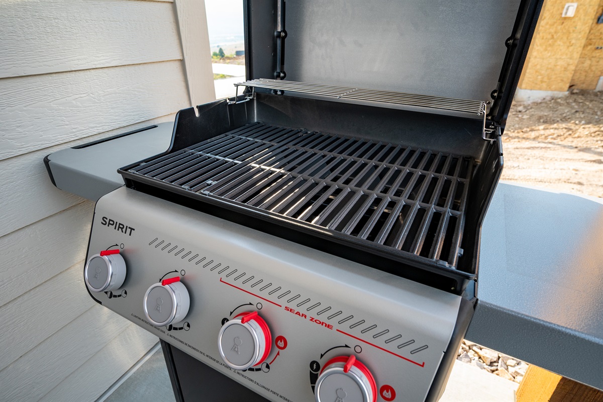 A Spirit propane grill is available for your use, perfect for cooking up delicious outdoor meals.