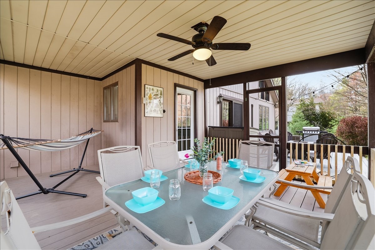 Enjoy bug-free outdoor dining on the screened porch, with direct access to the deck for easy gatherings and relaxing evenings
