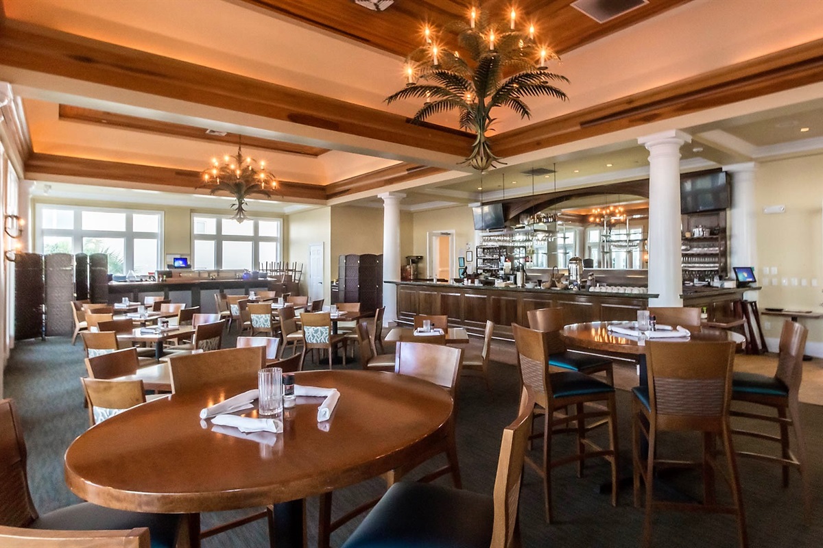 Experience the warm, inviting atmosphere at The Coast Restaurant. Our thoughtfully designed space, featuring rich wood accents and ambient lighting, provides the perfect setting for an unforgettable dining experience