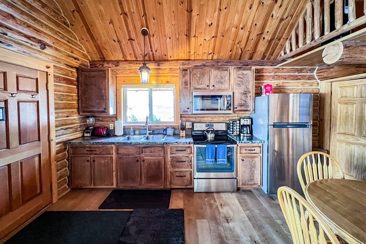Full Kitchen, well stocked with dish ware, cookware, utensils, etc.
