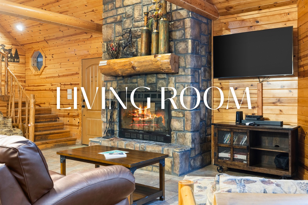 Living room with stone fireplace and comfy seating for cozy nights.