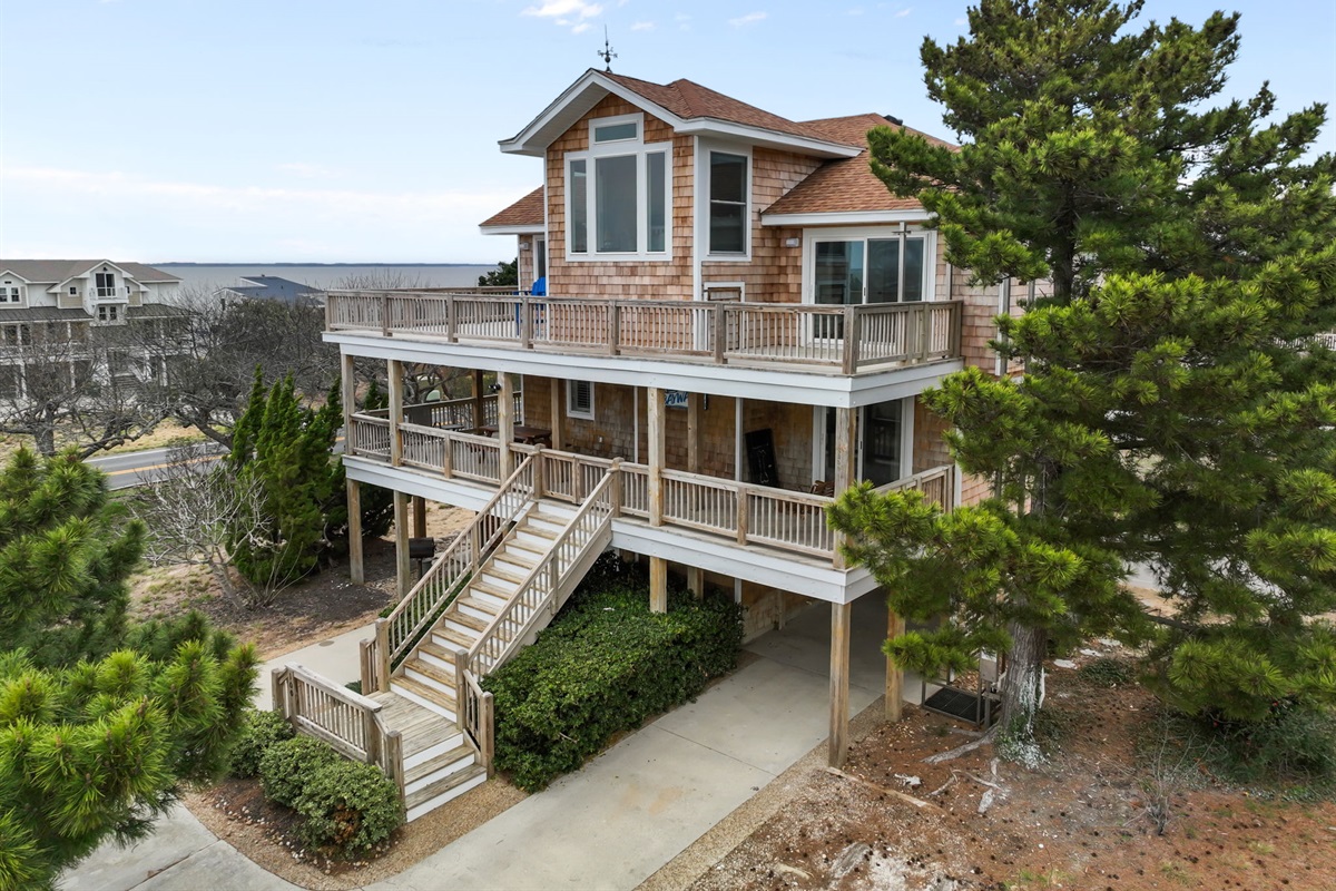 Side view showing the elevated design and plenty of outdoor space.