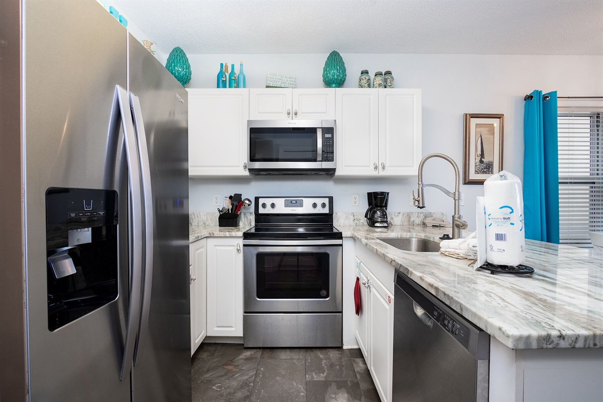 Kitchen with wood cabinets, granite countertops and stainless steel appliances