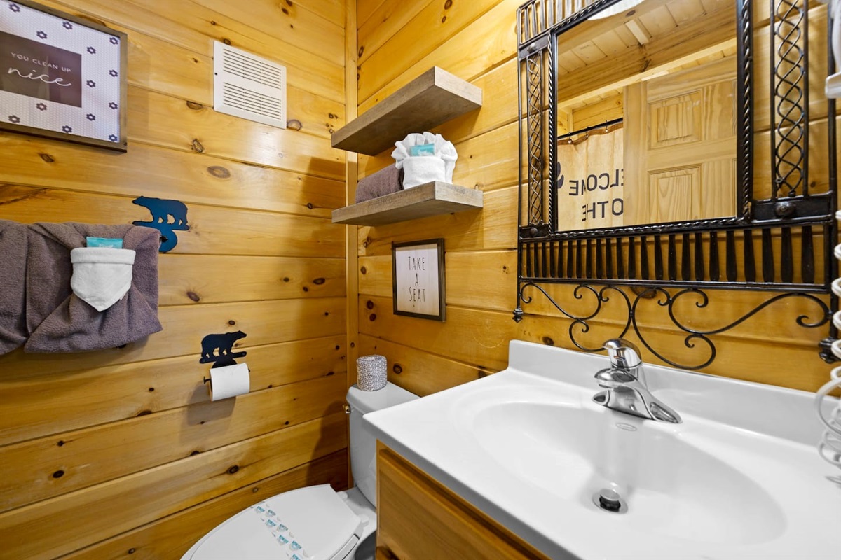 Front bedroom's en-suite bathroom. Bathroom has a combination shower and tub.