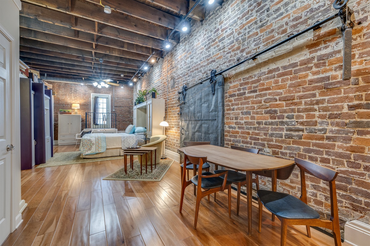 This building is over 100 years old, and this is the original fire door. We have restored this building and preserved the original brick. 