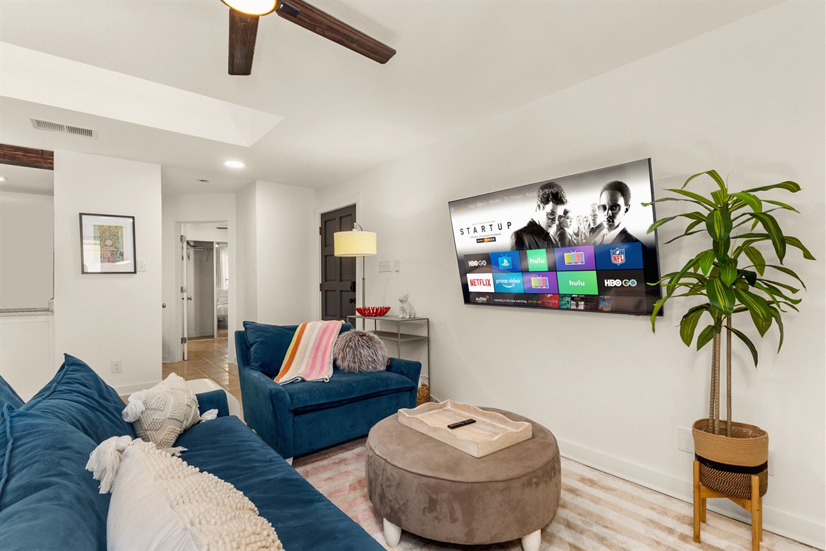 Bright living room with plush sectional perfect for movie nights and game days