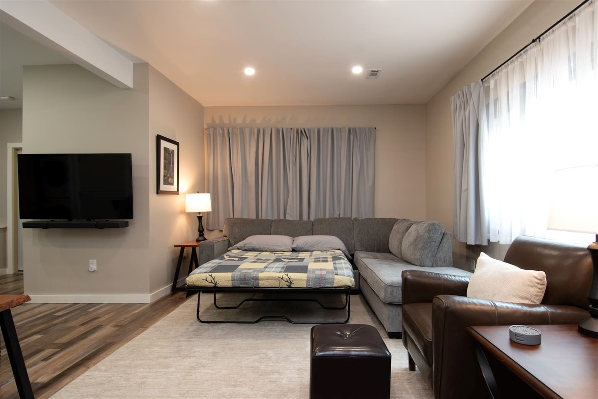 The TV can be moved to allow viewing from the bed.