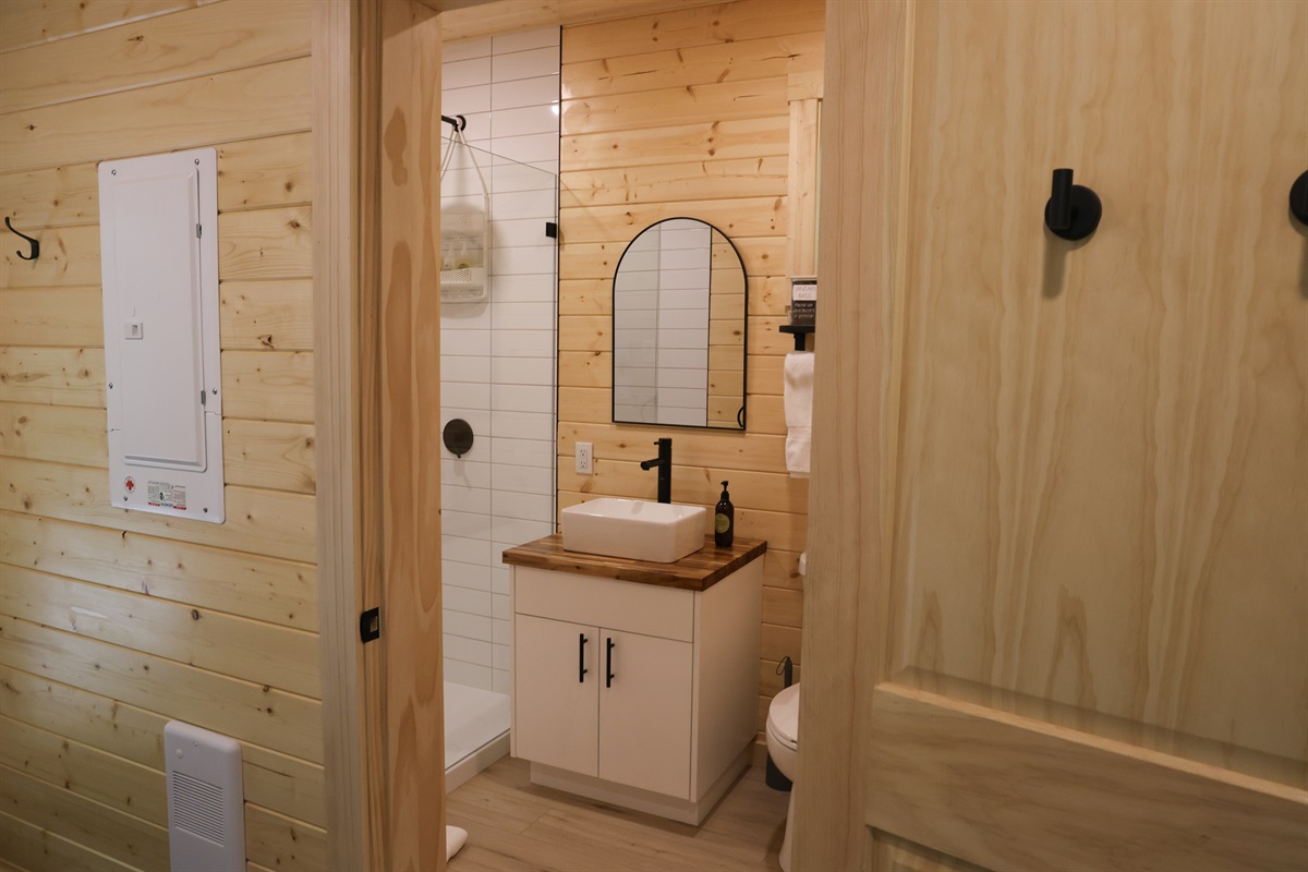 Premium bathroom with standing shower and non-toxic, Canadian made soaps by Oneka