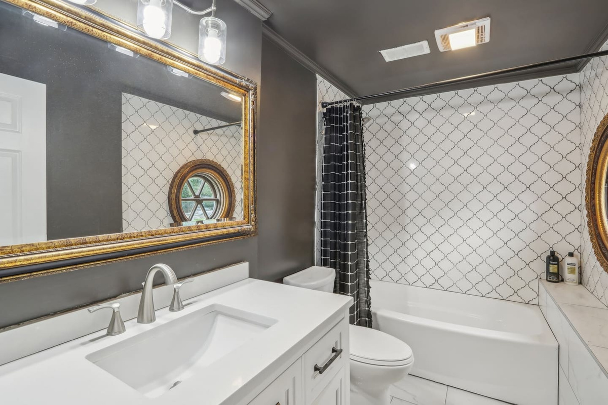 Freshen up in full bathroom 2, featuring a convenient shower/tub combo, spacious vanity, and stylish details for a comfortable daily routine.
