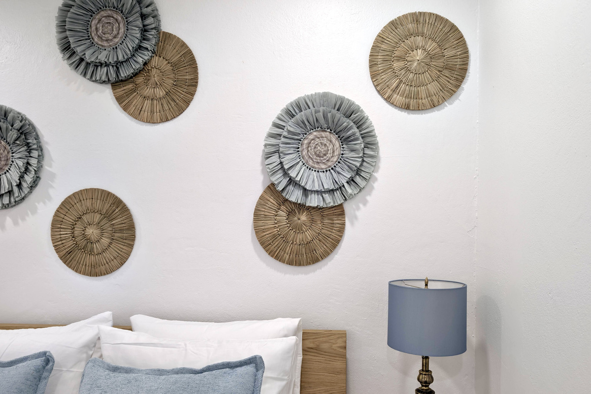Beautiful textures and calming tones add the perfect finishing touch to this cozy bedroom retreat.