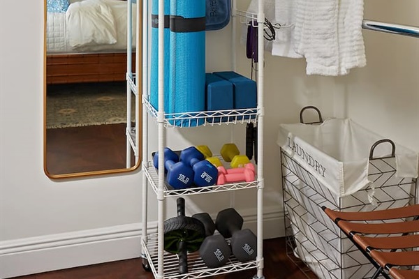 Spacious walk-in closet featuring plush robes and convenient exercise equipment to help you stay fit while away, plus yoga mats for a peaceful morning stretch or poolside session.